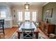 Elegant dining room featuring a large wooden table, stylish chairs, and natural light at 139 S Laurel Ave, Charlotte, NC 28207