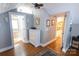 Attic hallway with wood floors connecting bedroom and bath in neutral colors at 139 S Laurel Ave, Charlotte, NC 28207
