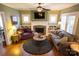 Bright living room featuring a fireplace, built-in shelves, and lots of natural light at 139 S Laurel Ave, Charlotte, NC 28207