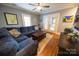 Comfortable living room offers hardwood floors, recessed lighting, a large sectional sofa, and bright French doors at 139 S Laurel Ave, Charlotte, NC 28207