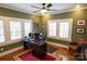 Well-lit home office with a large desk, comfortable seating, and classic design elements at 139 S Laurel Ave, Charlotte, NC 28207
