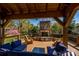 Charming outdoor living area with a stone fireplace, comfortable seating, and a beautiful view at 139 S Laurel Ave, Charlotte, NC 28207