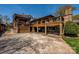 Impressive outdoor living space with covered decks, a stone fireplace, and a spacious patio at 139 S Laurel Ave, Charlotte, NC 28207