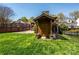 Backyard shed with stone accents, offering practical storage and complementing the home's design at 139 S Laurel Ave, Charlotte, NC 28207