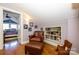 Cozy reading nook with leather chair and ottoman in finished attic room at 139 S Laurel Ave, Charlotte, NC 28207