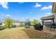 Large backyard with a trampoline, grill, and screened-in porch visible from the grassy lawn at 1430 Whitman Ct, York, SC 29745