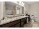 Bathroom with double sinks, a large mirror, and a walk-in shower at 1430 Whitman Ct, York, SC 29745