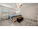 Bedroom with carpet, natural lighting, and simple furnishings, including a bed and dresser at 1430 Whitman Ct, York, SC 29745