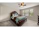 Cozy bedroom with a decorative wooden bed frame, multiple windows, and neutral walls at 1430 Whitman Ct, York, SC 29745