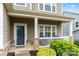 Inviting front porch with stone accents, offering a cozy spot to relax and enjoy the neighborhood view at 1430 Whitman Ct, York, SC 29745