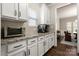Elegant kitchen countertop with white cabinetry, granite countertops, and modern appliances at 1430 Whitman Ct, York, SC 29745