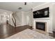 Cozy living room area featuring a fireplace and staircase at 1430 Whitman Ct, York, SC 29745