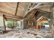 Inviting lounge featuring stone floors, wood ceilings, and comfortable seating; perfect for gatherings at 1430 Whitman Ct, York, SC 29745