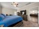 Bedroom features a ceiling fan, large bed, and an adjacent doorway at 1430 Whitman Ct, York, SC 29745