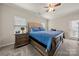 Bedroom with a large window, ceiling fan, hardwood bed frame, and carpet flooring at 1430 Whitman Ct, York, SC 29745