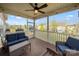 Screened-in porch featuring wicker furniture, string lights, and views of the backyard at 1430 Whitman Ct, York, SC 29745