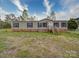 Inviting single-story home featuring a classic design with charming shutters and a well-manicured lawn at 1459 Wehunt Store Rd, Cherryville, NC 28021