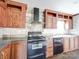 Well-equipped kitchen featuring dark countertops, stylish cabinetry, and modern appliances at 1459 Wehunt Store Rd, Cherryville, NC 28021