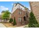 Beautiful brick townhome with manicured landscaping and charming rooftop garden at 15041 New Amsterdam Ln, Charlotte, NC 28204