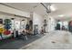 Spacious garage used as a home gym featuring weightlifting equipment, bike, and Peloton, offering space for fitness at 15041 New Amsterdam Ln, Charlotte, NC 28204