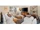 Inviting living room with plush white sofa, stylish decor, and ample natural light at 15041 New Amsterdam Ln, Charlotte, NC 28204