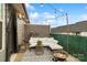 Inviting outdoor patio with white cushioned seating, string lights, decorative greenery and a fire pit for relaxation at 15041 New Amsterdam Ln, Charlotte, NC 28204