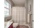 Cozy bathroom with a shower-tub combo, vanity, and neutral decor at 15211 Windward Ln, Lancaster, SC 29720