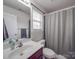 Bathroom featuring a single sink vanity and a shower with a gray shower curtain at 15211 Windward Ln, Lancaster, SC 29720