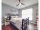 Comfortable bedroom featuring a decorative bed, a ceiling fan, and natural light at 15211 Windward Ln, Lancaster, SC 29720