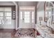 Welcoming foyer with a glass front door, hardwood floors, and an elegant console table at 15211 Windward Ln, Lancaster, SC 29720