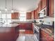Well-equipped kitchen boasts granite countertops, stainless steel appliances, and ample cabinet space at 15211 Windward Ln, Lancaster, SC 29720