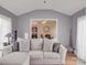 Comfortable living room with a neutral color scheme and large windows that let in plenty of natural light at 15211 Windward Ln, Lancaster, SC 29720