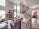 Spacious living room boasting a high ceiling, fireplace, and open layout with a staircase at 15211 Windward Ln, Lancaster, SC 29720