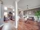 Inviting open-concept living room and dining area with a cozy fireplace and hardwood floors at 15211 Windward Ln, Lancaster, SC 29720