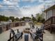 Relaxing outdoor patio area with a stone kitchen, fire pit, and chairs perfect for entertaining guests at 15211 Windward Ln, Lancaster, SC 29720