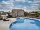 Inviting backyard pool with lounge area, perfect for relaxation and outdoor entertainment at 15211 Windward Ln, Lancaster, SC 29720