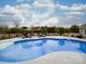 Sparkling in-ground pool with a built-in spa and poolside lounge chairs for relaxation and enjoyment at 15211 Windward Ln, Lancaster, SC 29720