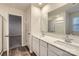 Bathroom featuring double vanity with quartz countertops and a large mirror above at 1526 Cottage Creek Dr, Bessemer City, NC 28016