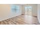Bright room with sliding glass doors leading to the outside, featuring hardwood floors and a window at 1526 Cottage Creek Dr, Bessemer City, NC 28016
