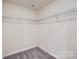 Spacious walk-in closet with carpeted flooring and wire shelving for organized storage at 1526 Cottage Creek Dr, Bessemer City, NC 28016