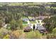 Wonderful aerial view of home nestled in beautiful wooded lot with mature trees and manicured landscaping at 164 Crooked Branch Way, Troutman, NC 28166