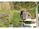 Aerial view of home showing large manicured lawn, stone driveway, and landscaping at 164 Crooked Branch Way, Troutman, NC 28166