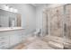 Bathroom with tile flooring and glass enclosed shower plus white vanity with drawers and sink at 164 Crooked Branch Way, Troutman, NC 28166