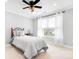 Bedroom boasts plush carpeting, a ceiling fan, and natural light at 164 Crooked Branch Way, Troutman, NC 28166