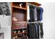 Walk-in closet with custom shelving and storage for shoes and clothing at 164 Crooked Branch Way, Troutman, NC 28166