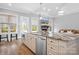 Gourmet kitchen featuring a large island, granite countertops, and modern stainless steel appliances at 164 Crooked Branch Way, Troutman, NC 28166
