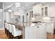 Open concept kitchen with white cabinets, stainless appliances, and granite countertops at 164 Crooked Branch Way, Troutman, NC 28166