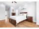 Comfortable main bedroom featuring hardwood floors, a ceiling fan, and neutral decor at 164 Crooked Branch Way, Troutman, NC 28166