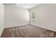 Cozy bedroom with natural light and plush carpeting at 1650 Troon Dr, Salisbury, NC 28144