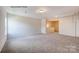 Large bonus room with neutral carpeting and bright lighting at 1650 Troon Dr, Salisbury, NC 28144
